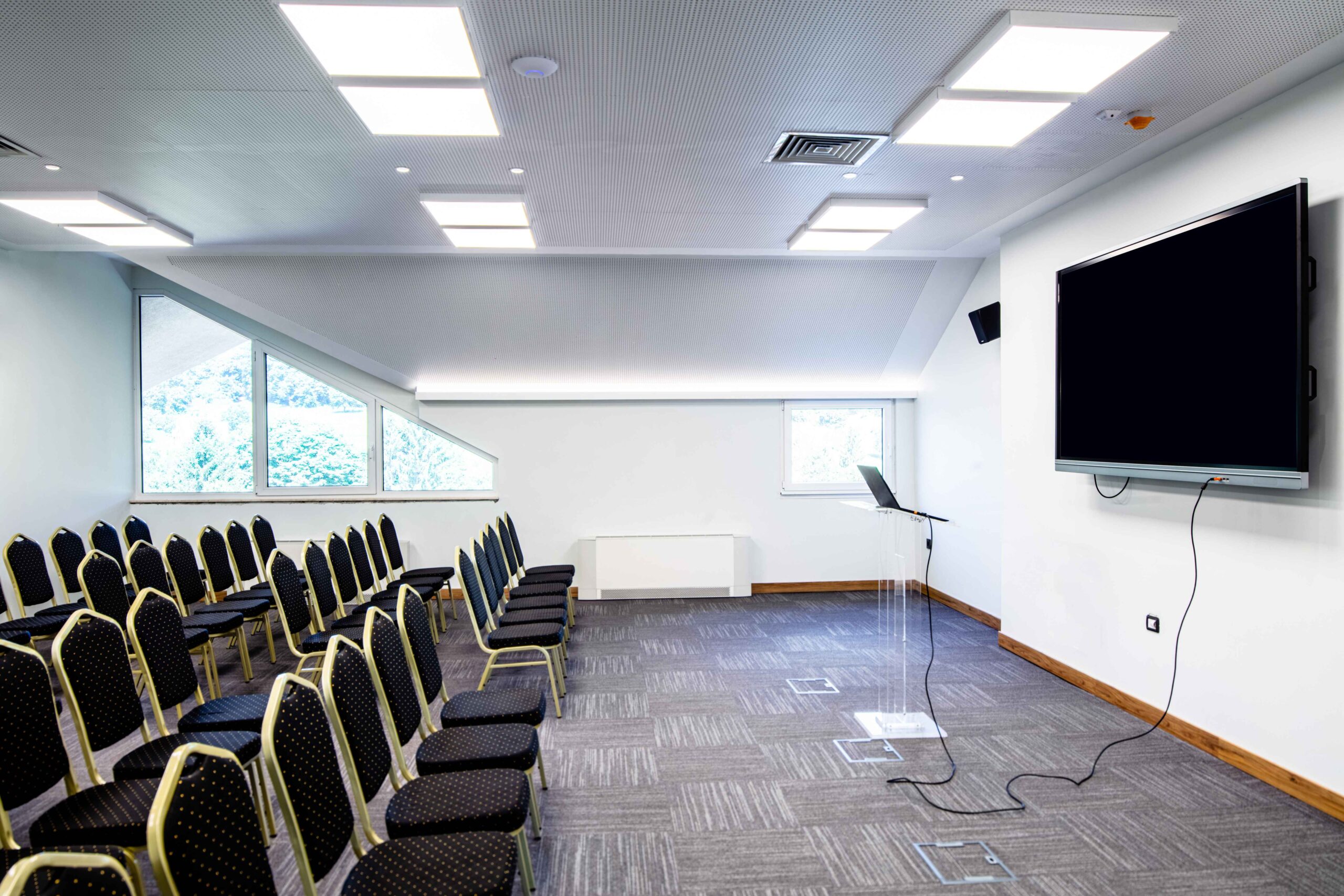conference-hall-empty-seats-row-projection-screen-before-seminar_11zon